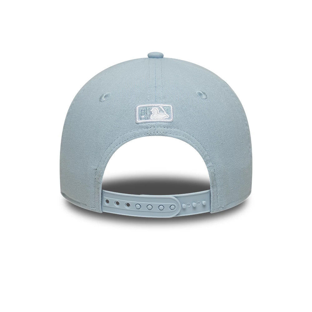 New York Mets MLB Linen Pastel Blue New Era 9FORTY M-Crown Adjustable Cap, rear view showing the white embroidered MLB Batterman logo at the centre back, a pastel blue adjustable strap with multiple holes, and a soft fabric crown.