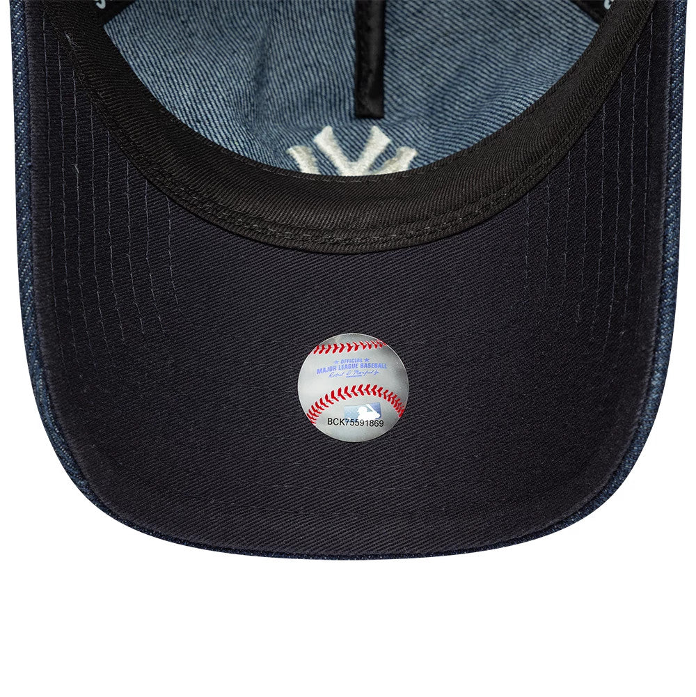 New York Yankees Womens MLB Denim Navy New Era 9TWENTY A-Frame Adjustable Cap, inside view showing the denim taping, navy undervisor with a holographic sticker resembling a baseball, and the white Yankees logo embroidered on the sweatband.