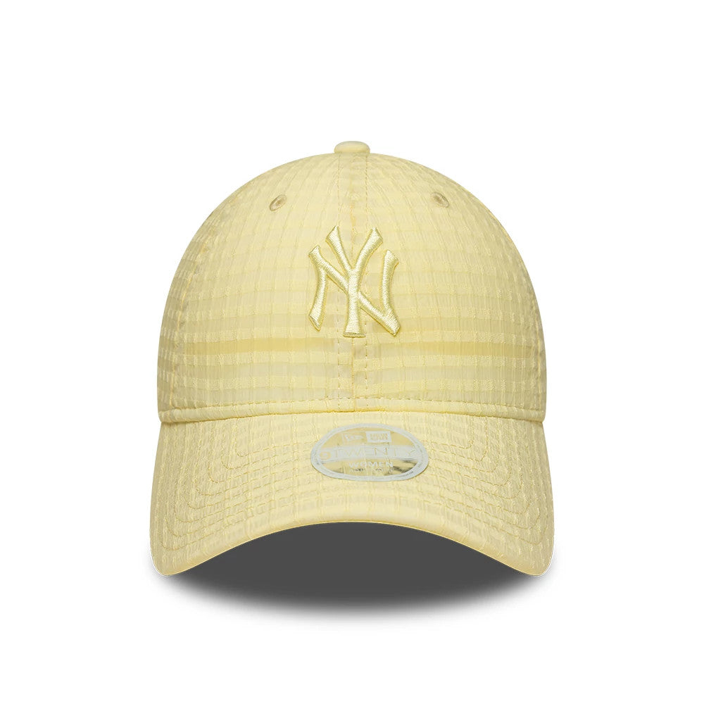 New York Yankees Womens MLB Seersucker Pastel Yellow New Era 9TWENTY Adjustable Cap, front view showing the NY logo embroidered on the unstructured pastel yellow crown, with a matching curved visor and a 9TWENTY size sticker in silver.