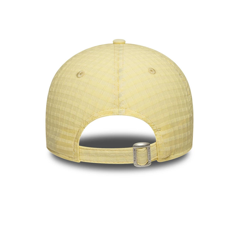 New York Yankees Womens MLB Seersucker Pastel Yellow New Era 9TWENTY Adjustable Cap, rear view showing the pastel yellow textured seersucker fabric with a curved opening, an adjustable strap featuring hardware, and embroidered eyelets.