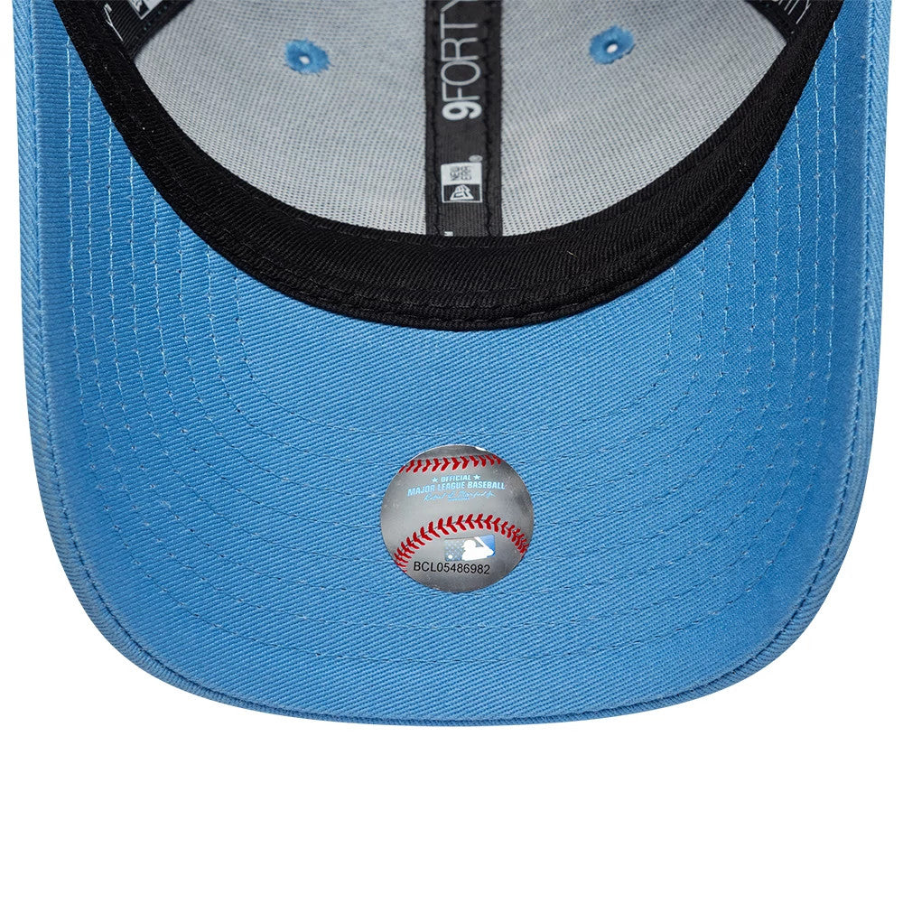 LA Dodgers Youth MLB League Essential Pastel Blue New Era 9FORTY Adjustable Cap, inside view showing the black sweatband with 9FORTY branding, blue undervisor, and the MLB authenticity sticker featuring a baseball design centred below the visor.
