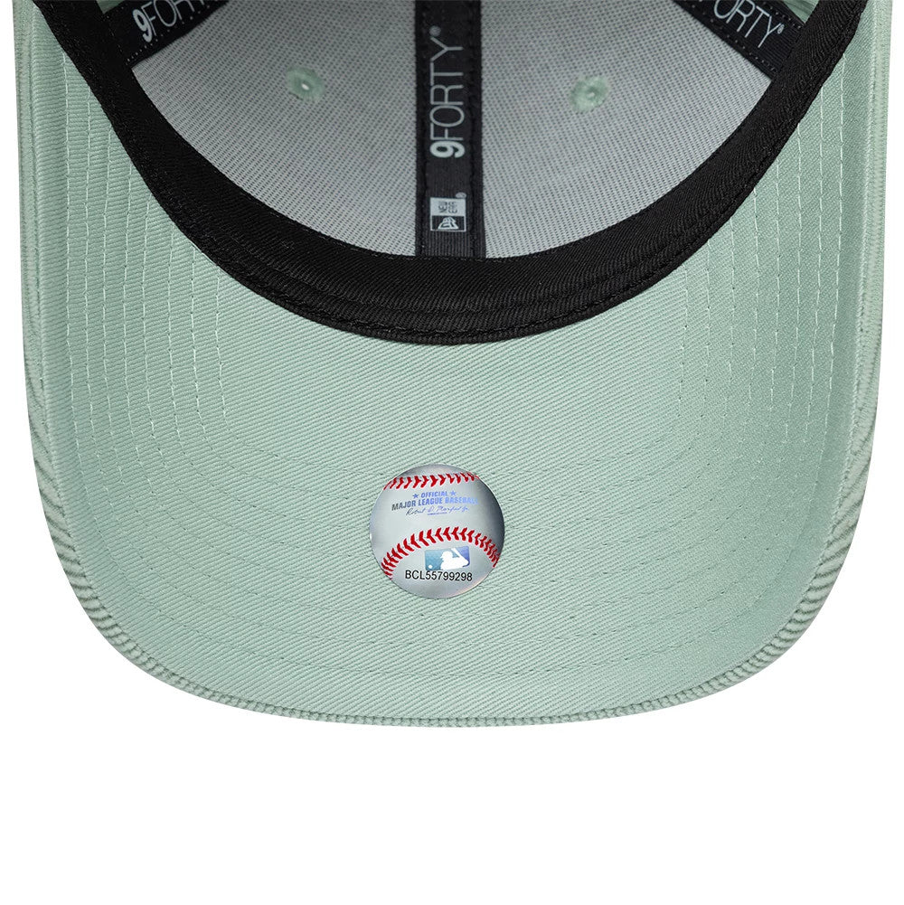 New York Yankees Womens MLB Cord Pastel Green New Era 9FORTY Adjustable Cap, inside view showing the black sweatband with grey 9FORTY taping, light green undervisor, and a round authentication sticker featuring a baseball motif.