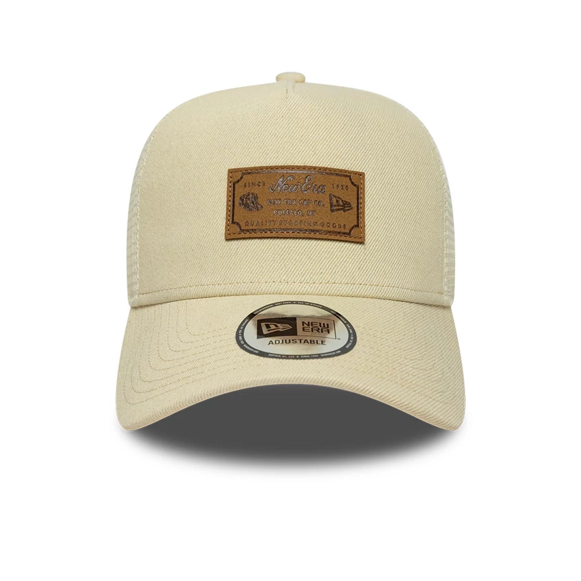 Pictured is this New Era Leather Patch 9FORTY A-Frame Trucker cap in light beige. 2