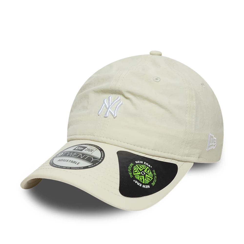 New York Yankees MLB Recycled Light Beige New Era 9TWENTY Adjustable Cap, front view showing a white embroidered NY logo on the unstructured beige crown, curved visor with a 9TWENTY size sticker, and the New Era flag logo on the left side.