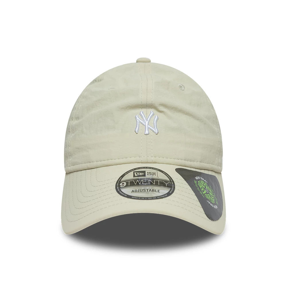 New York Yankees MLB Recycled Light Beige New Era 9TWENTY Adjustable Cap, front view showing the raised white NY logo embroidered on the front panel, curved visor with a 9TWENTY size sticker, and light beige fabric.