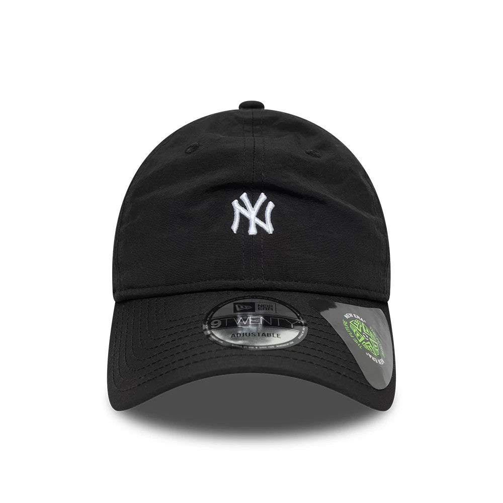 New York Yankees MLB Recycled Black New Era 9TWENTY Adjustable Cap, front view showing the raised white embroidered NY logo on the unstructured black crown, with a 9TWENTY size sticker and cardboard insert on the black curved visor.