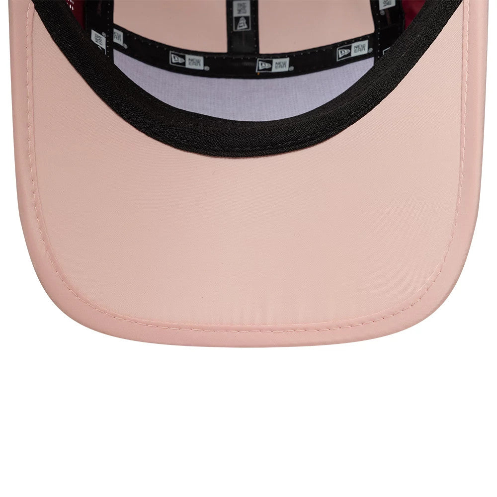 New Era Colour Block Dark Red Runner Adjustable Cap, inside view showing the black New Era branded taping along the seams, a contrasting black sweatband, and a soft pink undervisor highlighting the interior details.