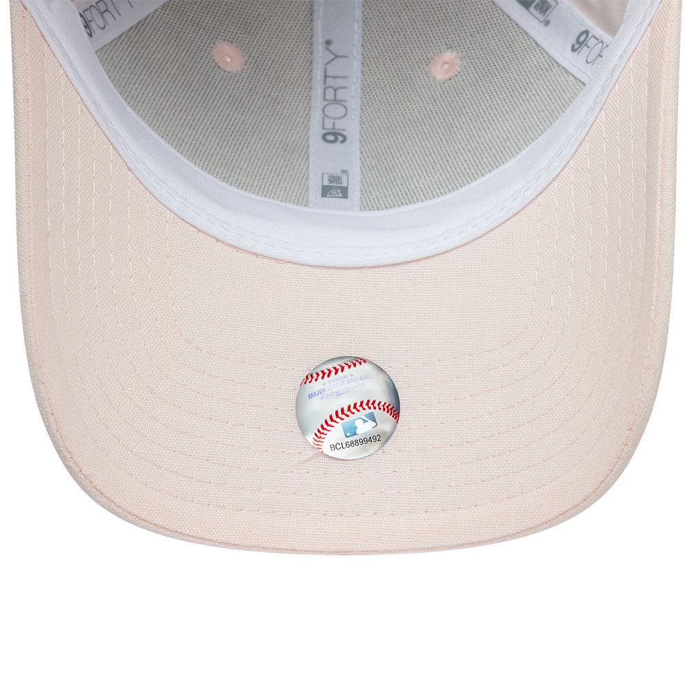 New York Yankees Womens MLB Linen Pastel Pink New Era 9FORTY Adjustable Cap, inside view showing a white internal sweatband, grey fabric taping with the 9FORTY logo, and a detailed baseball graphic sticker on the pastel pink undervisor.