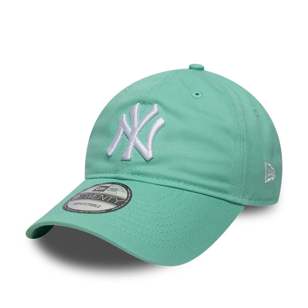 New York Yankees MLB League Essential Pastel Green New Era 9TWENTY Adjustable Cap, front view showing a raised white embroidered NY logo on the structured pastel green crown, with a matching curved visor and a 9TWENTY size sticker on the top.