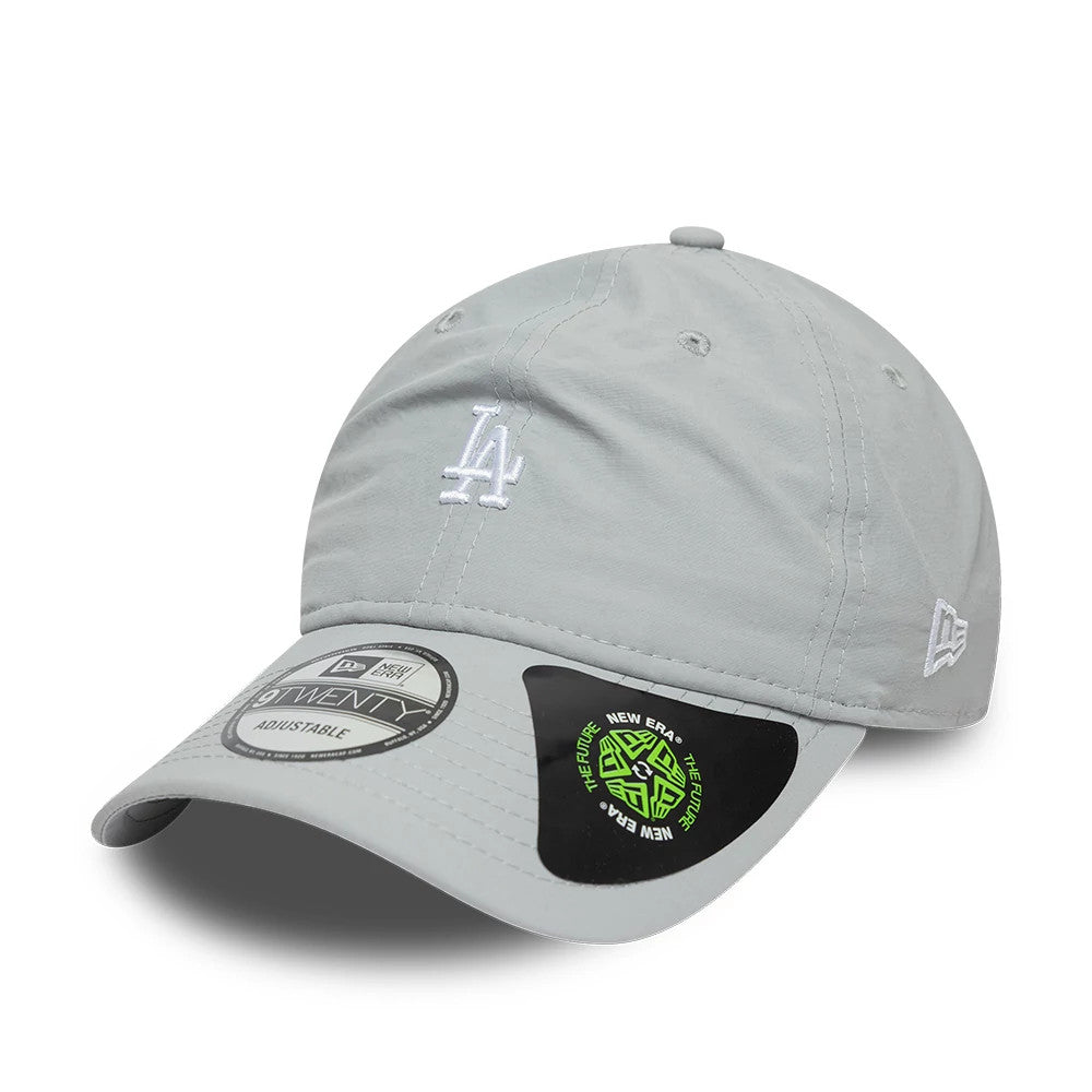 LA Dodgers MLB Recycled Grey New Era 9TWENTY Adjustable Cap, three-quarter view showing the white embroidered LA logo on the front panel, grey curved visor with a 9TWENTY size sticker, and New Era flag logo on the left side.