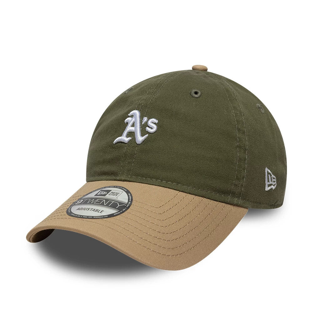 Athletics MLB Washed Contrast Green New Era 9TWENTY Adjustable Cap, three-quarter view showing the white embroidered A's logo on the front panel, a khaki curved visor with a 9TWENTY size sticker, and the New Era flag logo on the left side.