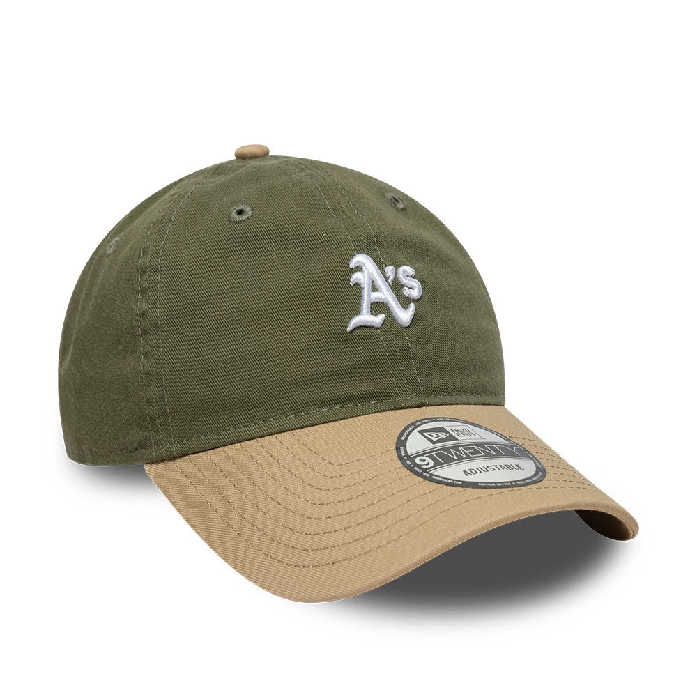 Athletics MLB Washed Contrast Green New Era 9TWENTY Adjustable Cap, three-quarter view showing the white raised embroidery of the A's logo on the structured green front panel, contrasted by a curved brown visor with a 9TWENTY size sticker.