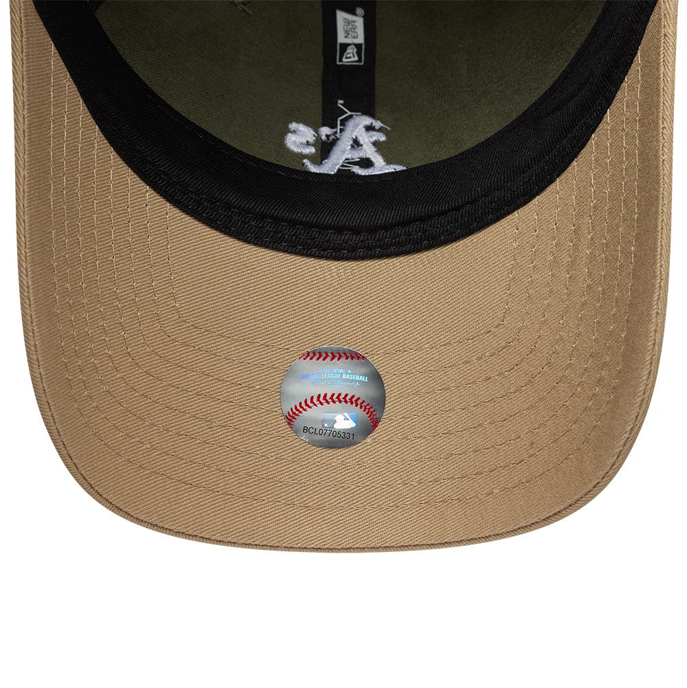 Athletics MLB Washed Contrast Green New Era 9TWENTY Adjustable Cap, inside view showing a green undervisor with black edge, white A logo embroidery on the interior, and a baseball hologram sticker on the visor.