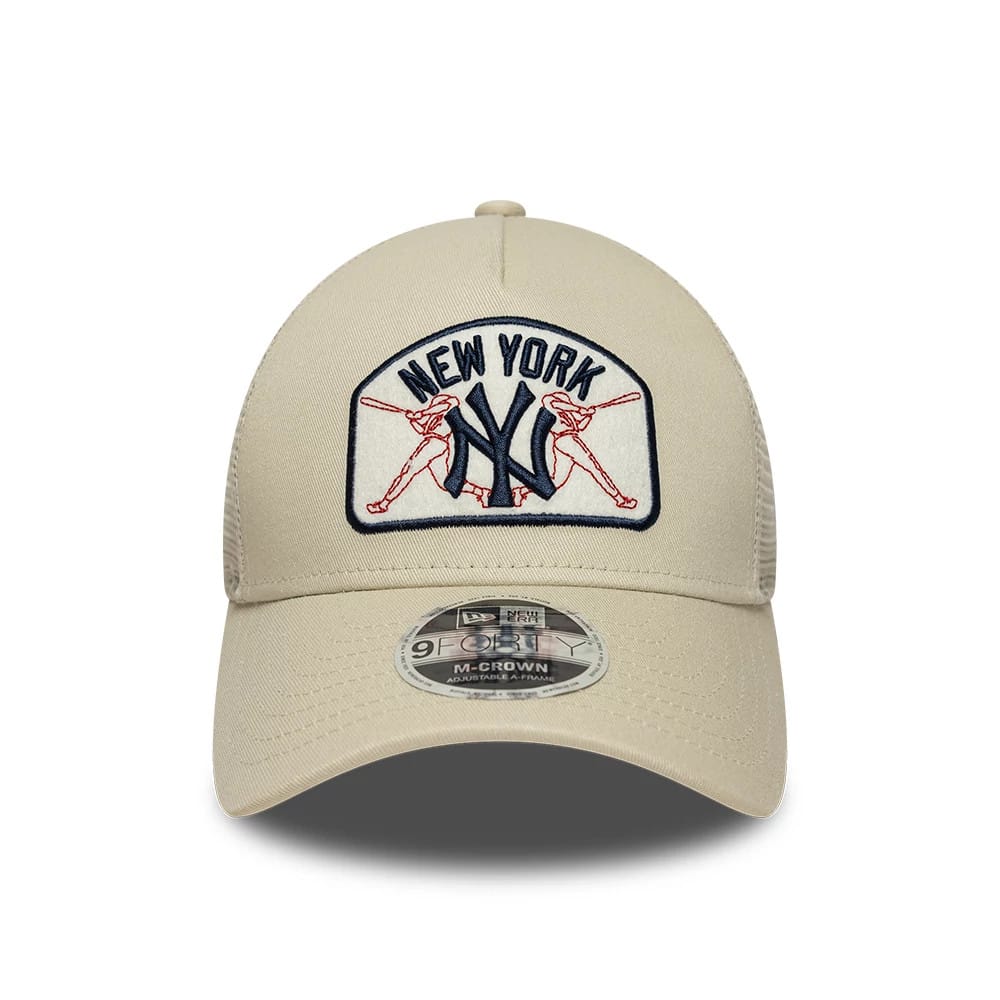 New York Yankees MLB Patch Cream New Era 9FORTY M-Crown A-Frame Trucker Adjustable Cap, front view showing a cream structured crown with a large embroidered New York Yankees logo, crossed baseball bats design.