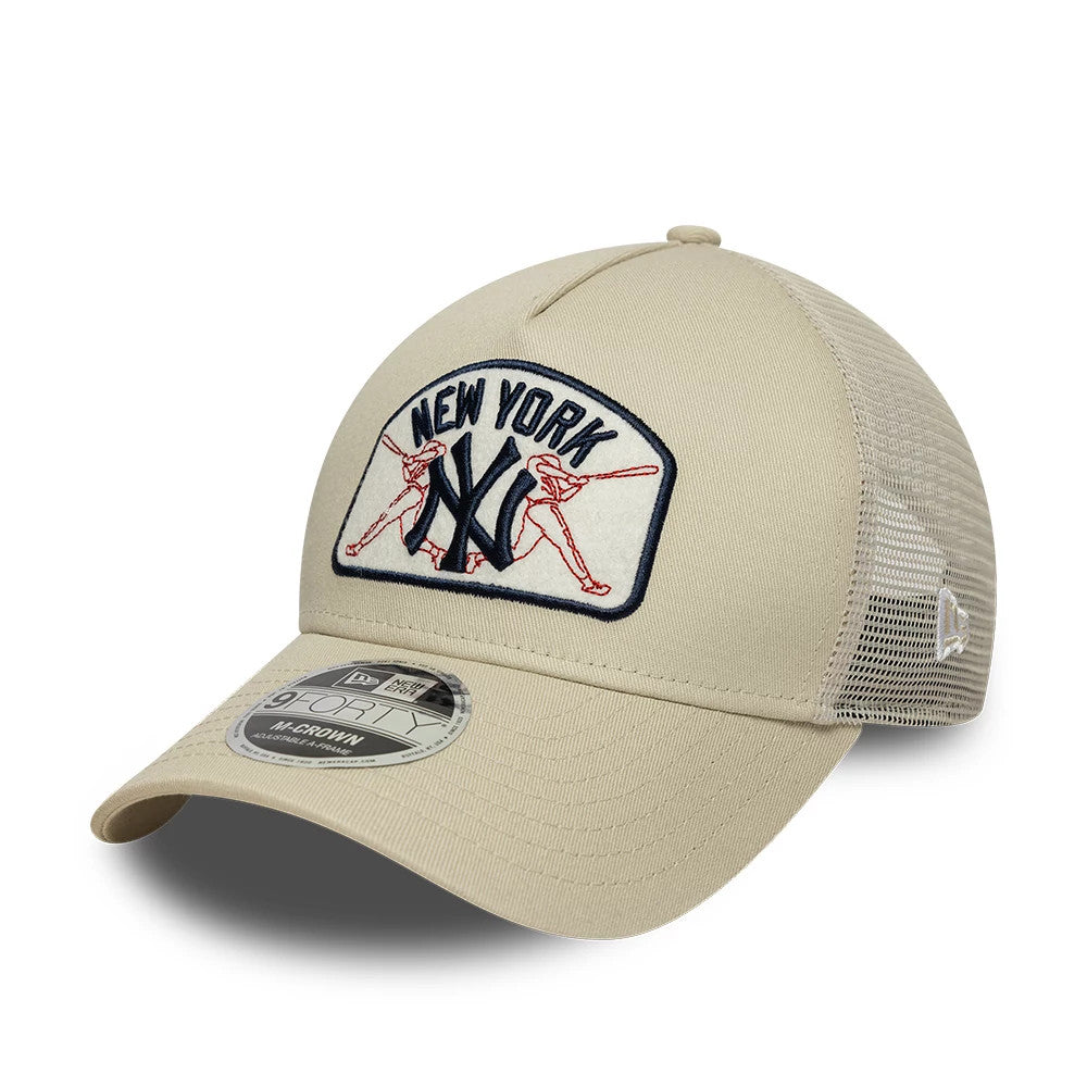 New York Yankees MLB Patch Cream New Era 9FORTY M-Crown A-Frame Trucker Adjustable Cap, three-quarter view showing the raised embroidered New York Yankees logo front patch, cream curved visor with a 9FORTY size sticker.