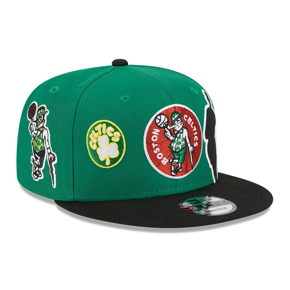 Boston Celtics NBA Hardwood Classic ASG Green New Era 9FIFTY Snapback Adjustable Cap, three-quarter view showing the embroidered Boston Celtics logos on the front and side panels, a black flat visor, and a 9FIFTY size sticker on the visor.