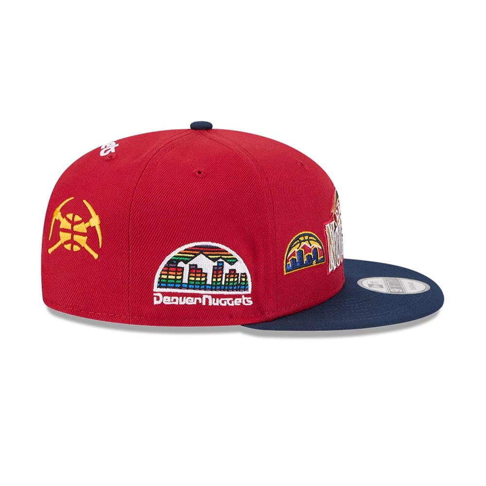 Nuggets NBA Hardwood Classic ASG Dark Red New Era 9FIFTY Snapback Adjustable Cap, side view showing a yellow crossed pickaxes graphic on the left panel, colourful Denver Nuggets cityscape embroidery.