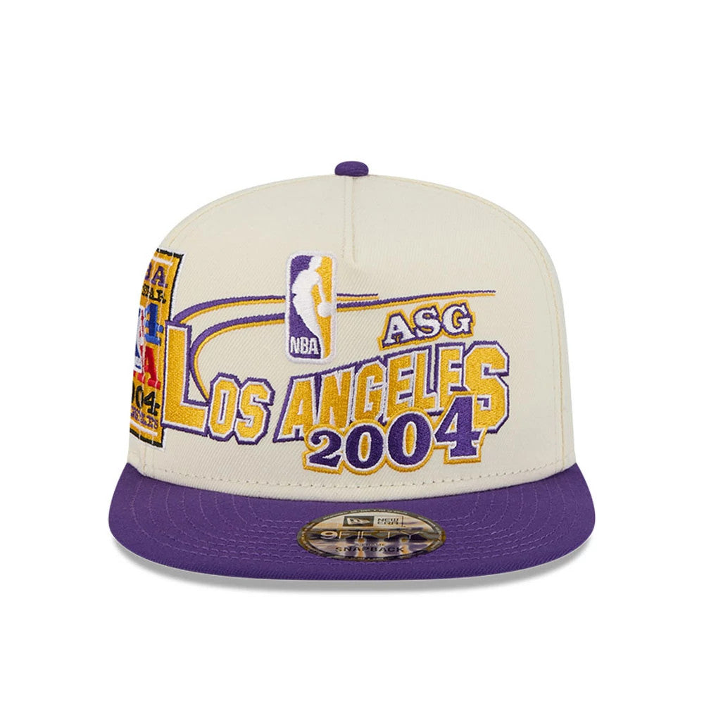 LA Lakers NBA Hardwood Classic ASG White New Era 9FIFTY A-Frame Snapback Cap, front view showing purple and gold embroidered Los Angeles 2004 lettering on the white front panel, with a purple flat visor and 9FIFTY size sticker.