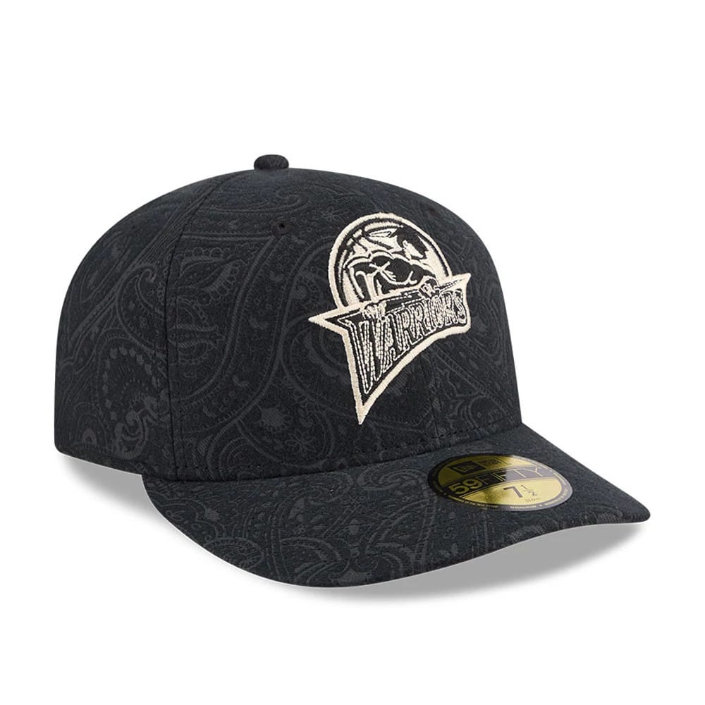Golden State Warriors NBA Brushed Cotton Black New Era 59FIFTY Fitted Cap, three-quarter view showing an embroidered Warriors logo in cream on the front panels, a paisley pattern covering the cap.