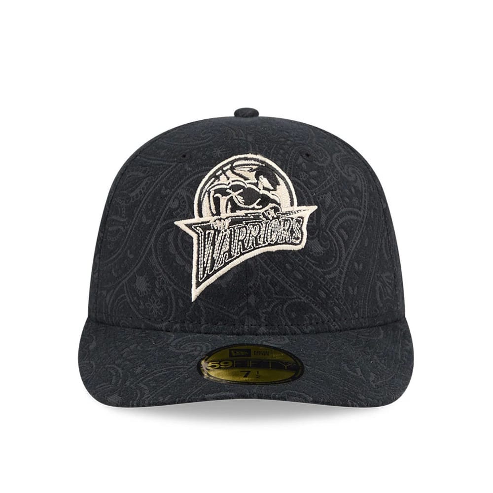 Golden State Warriors NBA Brushed Cotton Black New Era 59FIFTY Fitted Cap, front view showing the intricately detailed white embroidered Warriors graphic on the dark paisley-patterned crown, with a gold 59FIFTY size sticker on the black flat visor.