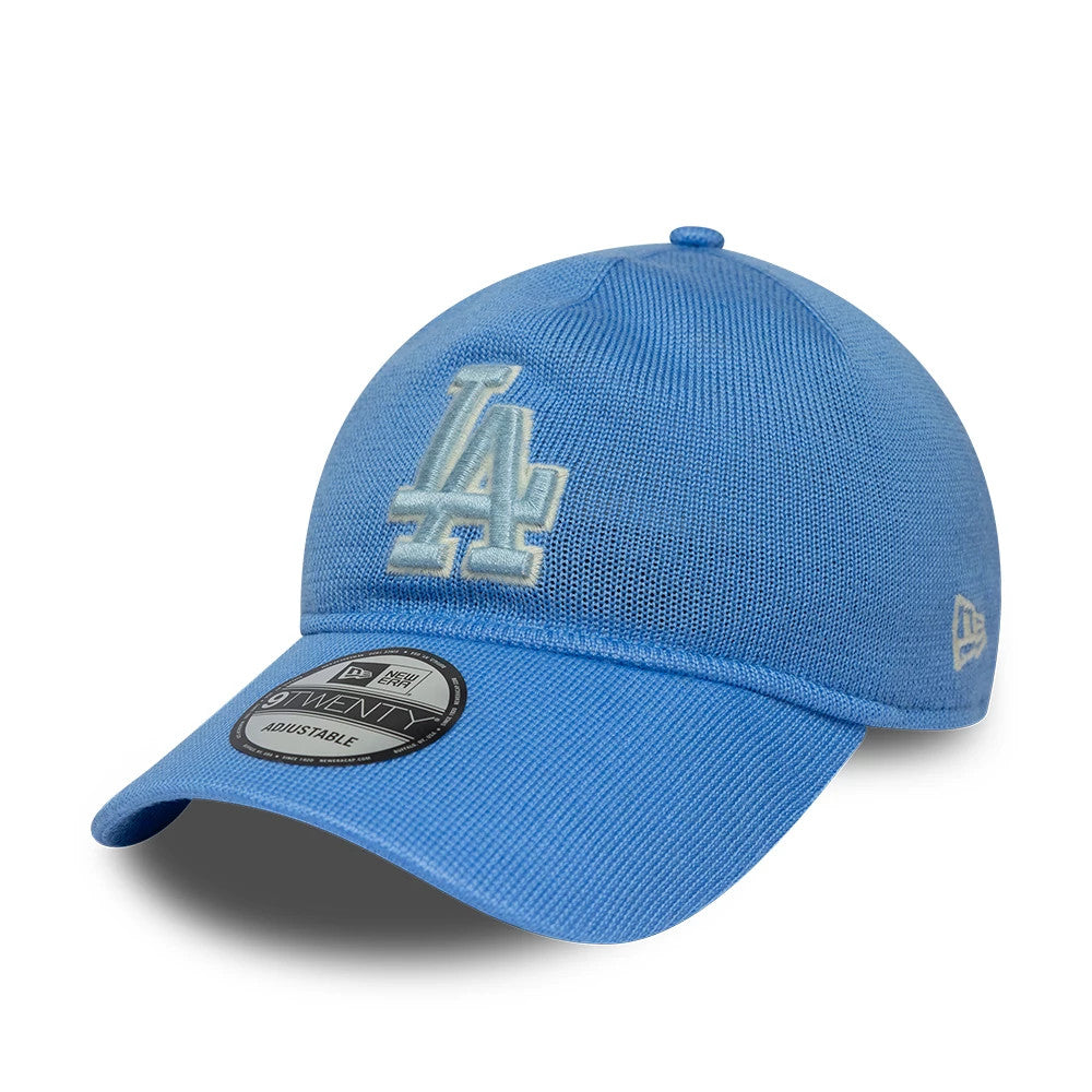 LA Dodgers MLB Merino Wool Pastel Blue New Era 9TWENTY Adjustable Cap, three-quarter view showing the raised white LA embroidery on the structured crown, a curved visor with a 9TWENTY size sticker, and the New Era flag logo on the left side.