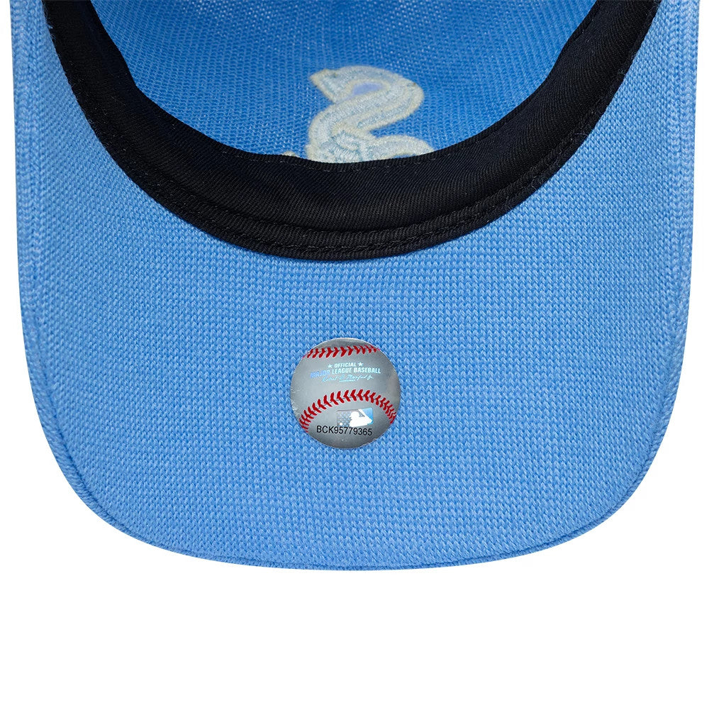 Chicago White Sox MLB Merino Wool Pastel Blue New Era 9TWENTY Adjustable Cap, inside view showing the black sweatband, a pastel blue undervisor with a holographic MLB certification sticker, and a glimpse of white embroidered logo stitching above.