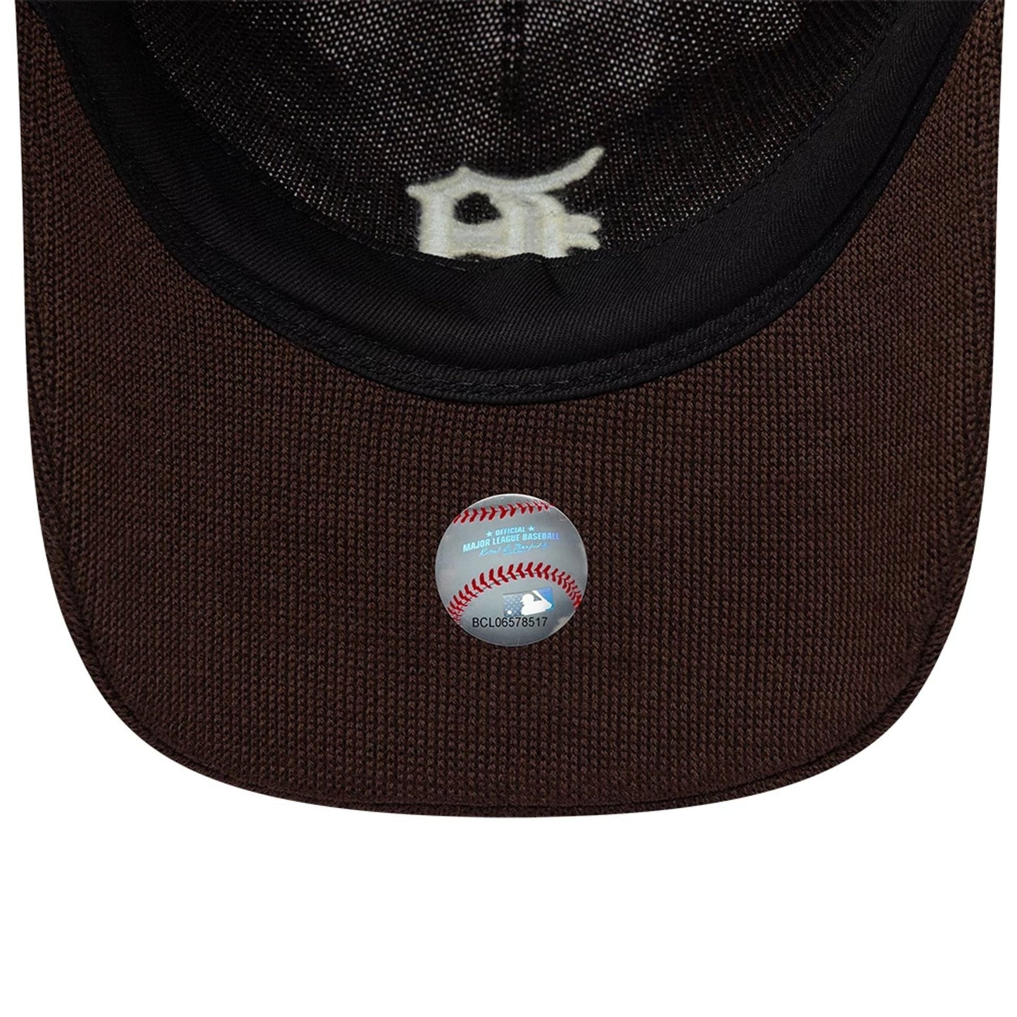 Detroit Tigers MLB Merino Wool Dark Brown New Era 9TWENTY Adjustable Cap, inside view showing the black sweatband, the dark brown fabric and sticker on the brown undervisor, and the embroidered white D logo on the inner panel.