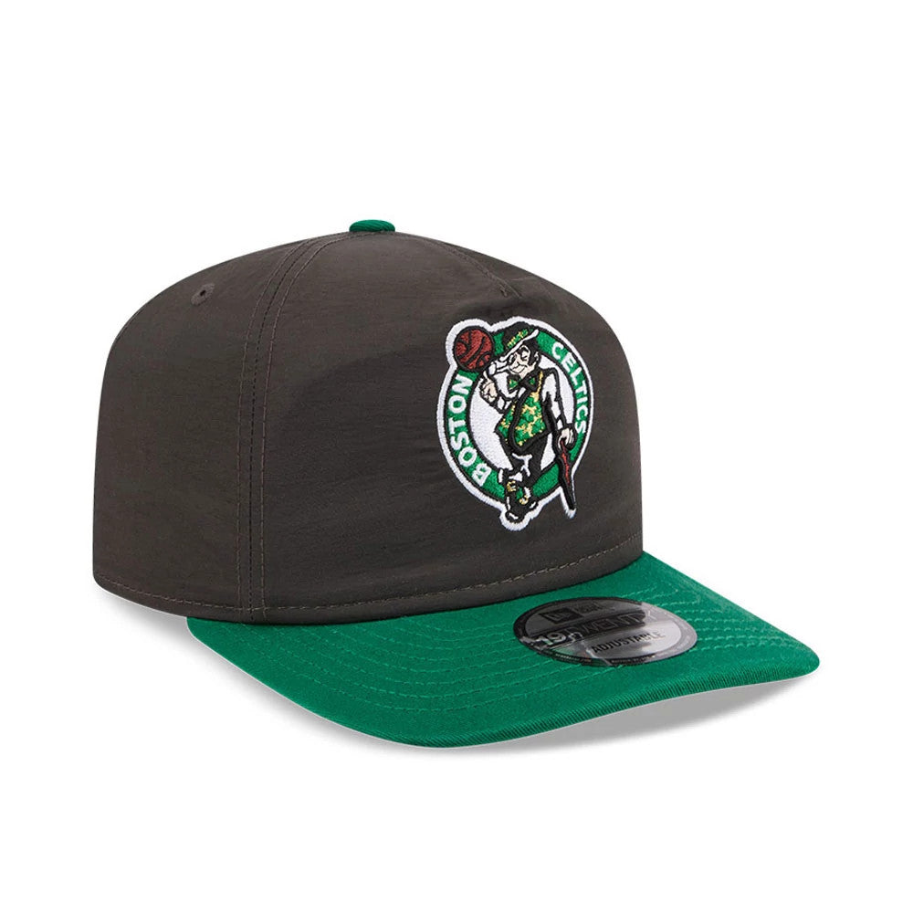 Boston Celtics NBA Nylon Black New Era 19TWENTY Adjustable Cap, three-quarter view showing a raised embroidered Celtics logo on the front panel, a contrasting green visor with an attached 19TWENTY size sticker, and a top button in green.