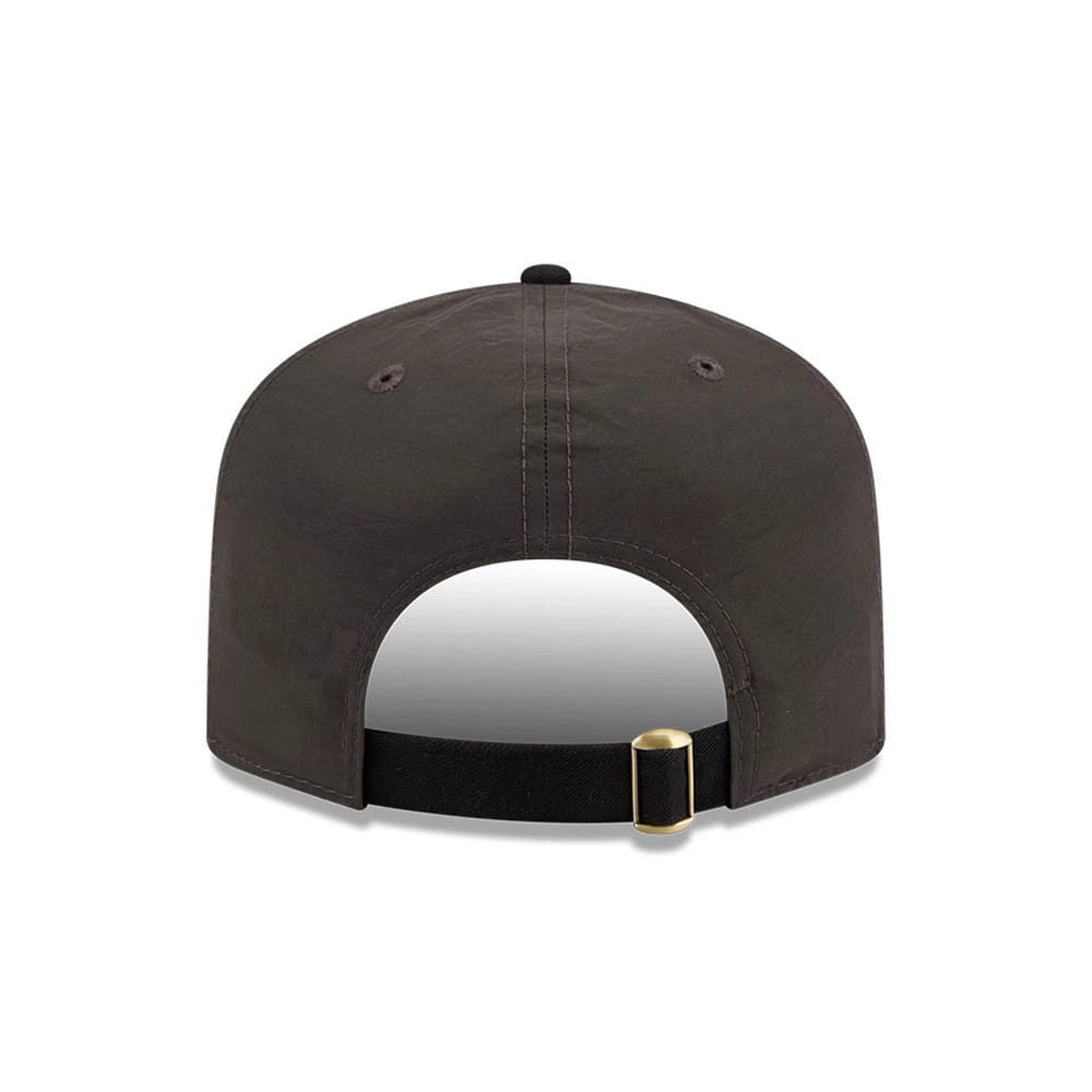 Chicago White Sox MLB Nylon Black New Era 19TWENTY Adjustable Cap, rear view showing the plain black back panels with stitched eyelets, a black adjustable strap featuring a brass buckle, and a matching black top button.
