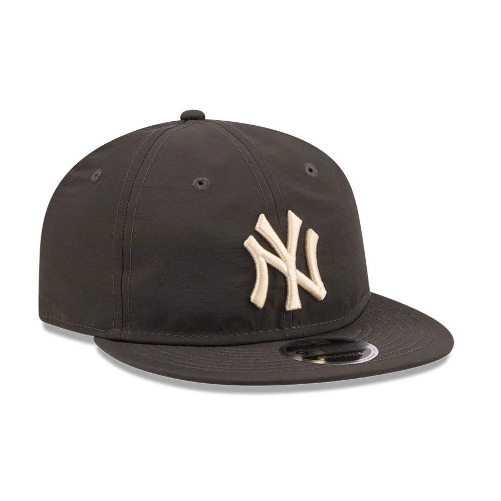 New York Yankees MLB Nylon Black Retro Crown New Era 9FIFTY Adjustable Cap, three-quarter view showing the raised beige embroidered NY logo on the front panel, with a flat black visor featuring a 9FIFTY size sticker, and eyelets.