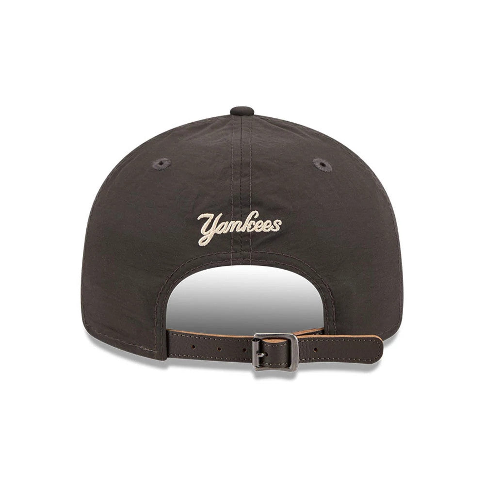 New York Yankees MLB Nylon Black Retro Crown New Era 9FIFTY Adjustable Cap, rear view showing the cream embroidered Yankees script logo centred on the unstructured black crown, with a black adjustable strap featuring a buckle.