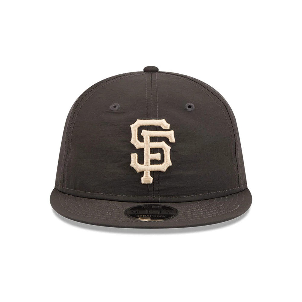 San Francisco Giants MLB Nylon Black Retro Crown New Era 9FIFTY Adjustable Cap, front view showing the raised beige embroidered SF logo on the black front panel, with a black curved visor and 9FIFTY size sticker prominently displayed.