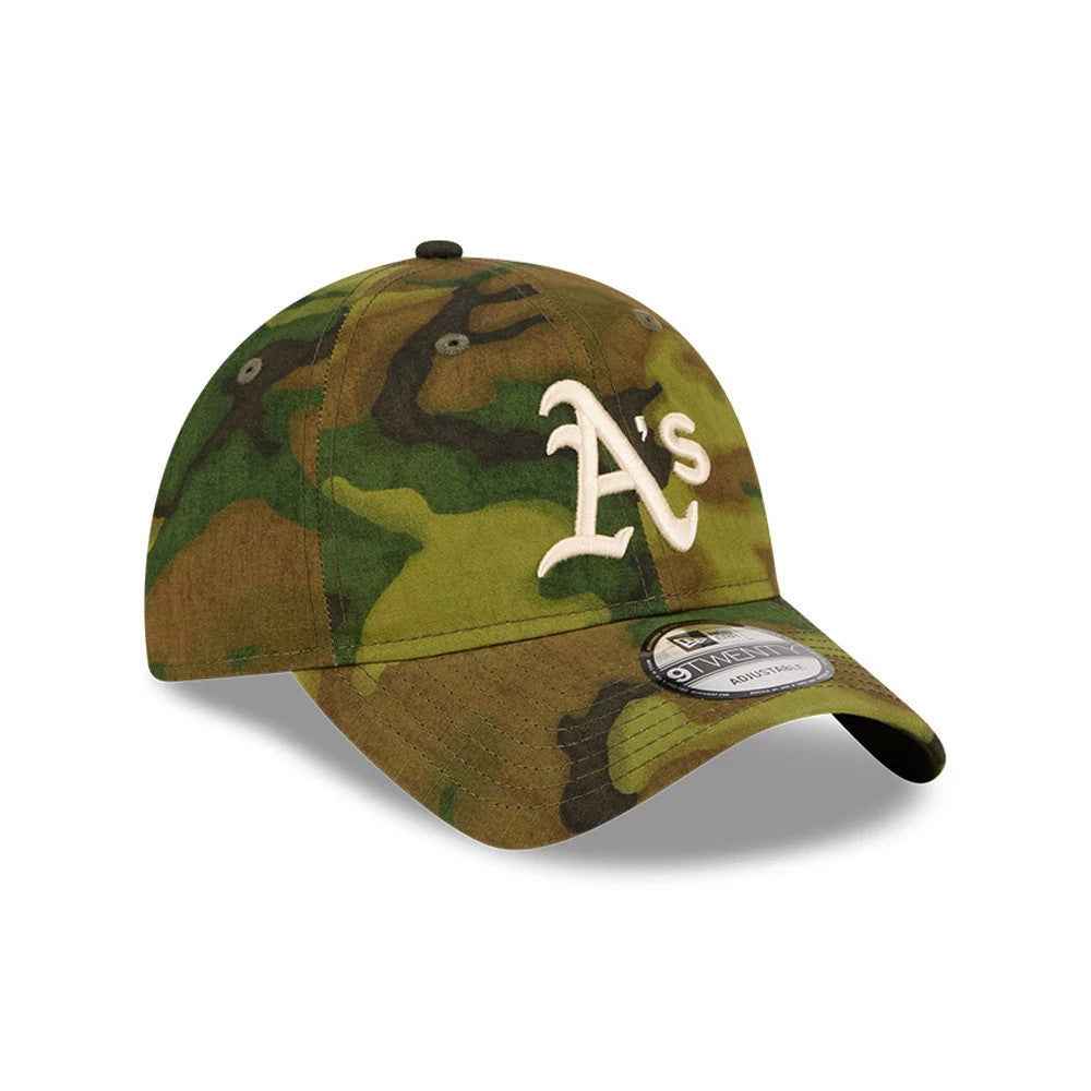 Athletics MLB Ripstop Camo New Era 9TWENTY Adjustable Cap, three-quarter view showing the white raised embroidered A's logo on the front panel, camouflage pattern covering the unstructured crown, and a 9TWENTY size sticker on the curved visor.