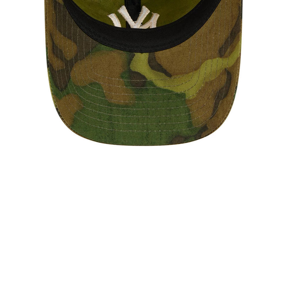 New York Yankees MLB Ripstop Camo New Era 9TWENTY Adjustable Cap, inside view showing the underside of the green camo visor with stitching, black sweatband, and the raised white Yankees logo embroidery against the dark interior fabric.