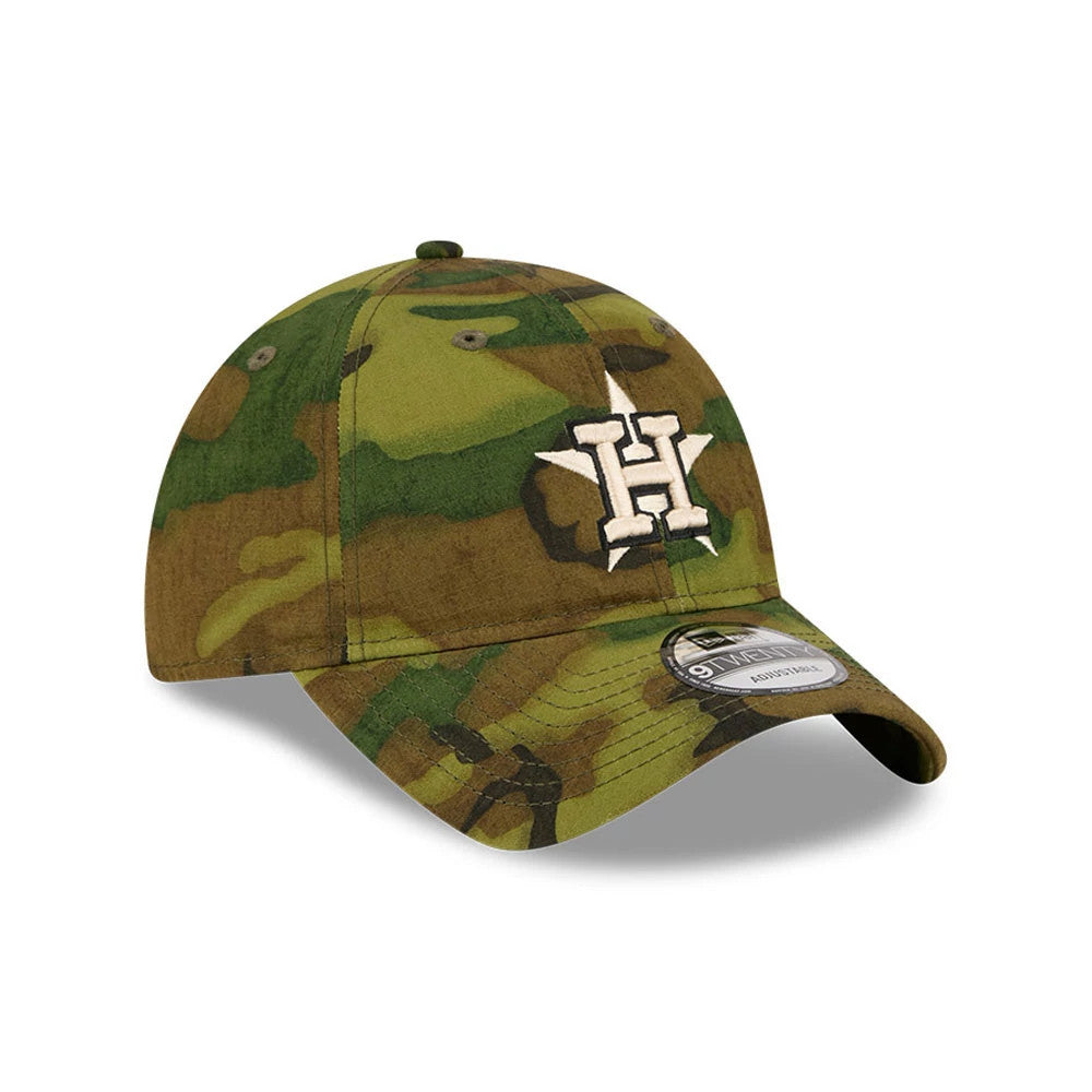 Houston Astros MLB Ripstop Camo New Era 9TWENTY Adjustable Cap, three-quarter view showing the white and black raised embroidered logo on the front panel, a camo pattern across the entire cap, and a 9TWENTY size sticker on the curved visor.