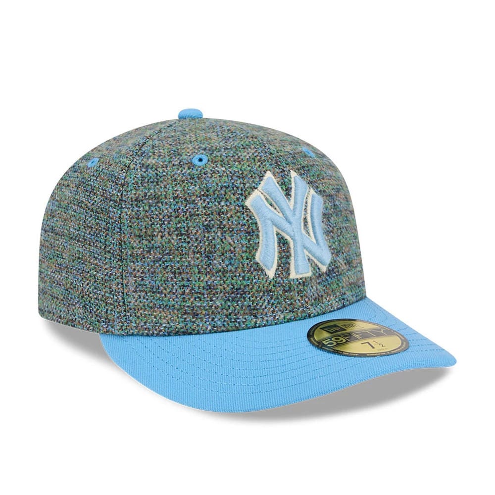 New York Yankees MLB Tweedy Cotton Pastel Blue New Era 59FIFTY Fitted Cap, front view showing a raised light blue NY logo embroidered on the speckled tweed crown, with a matching pastel blue visor and a gold 59FIFTY size sticker on the visor.