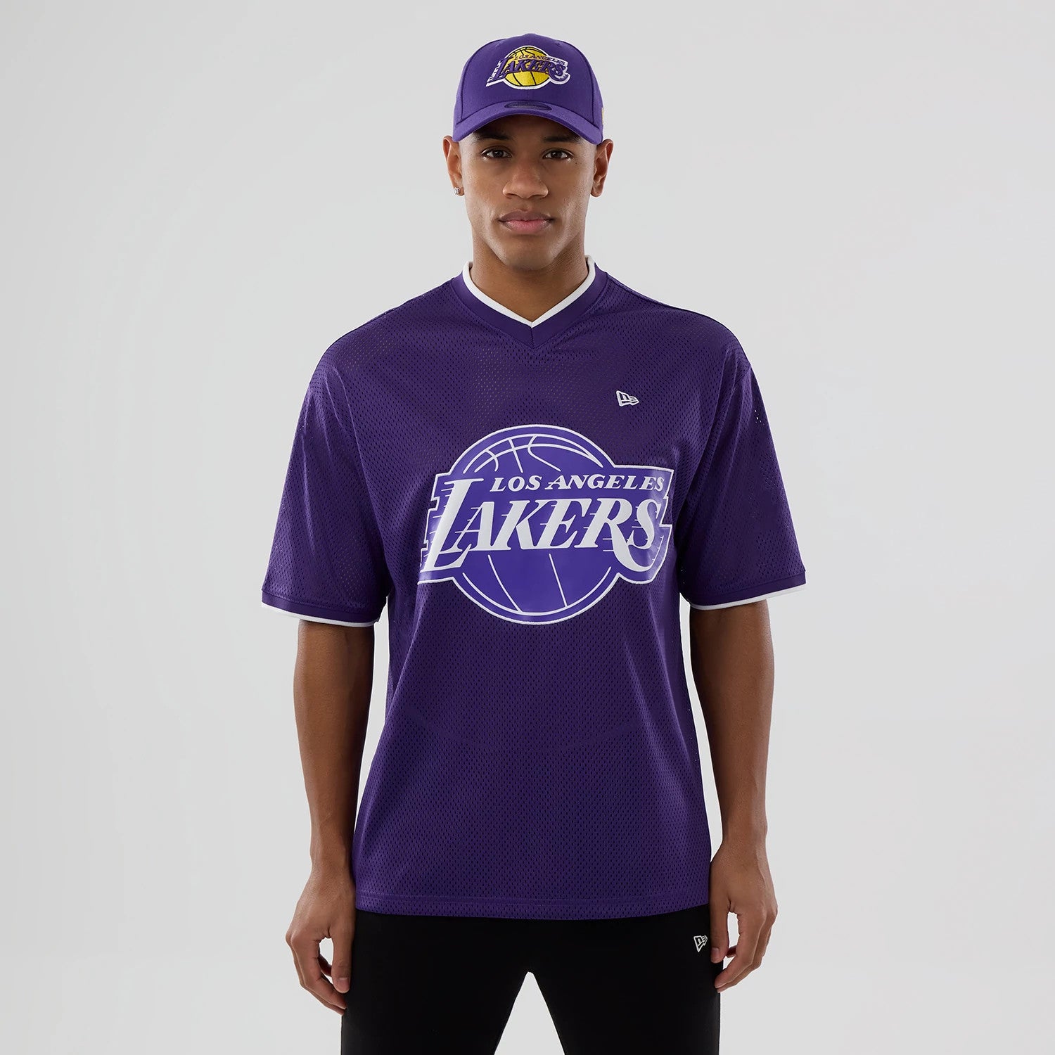 The model is wearing this NBA Mesh LA Lakers Oversized T-Shirt in purple. 1