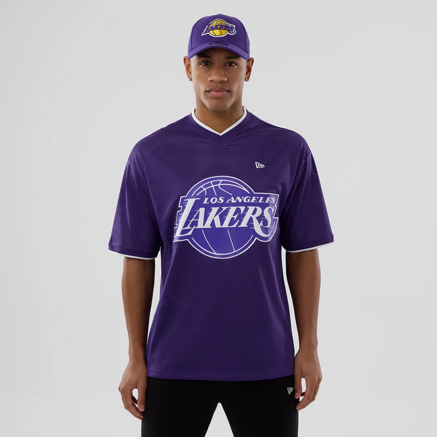The model is wearing this NBA Mesh LA Lakers Oversized T-Shirt in purple. 1