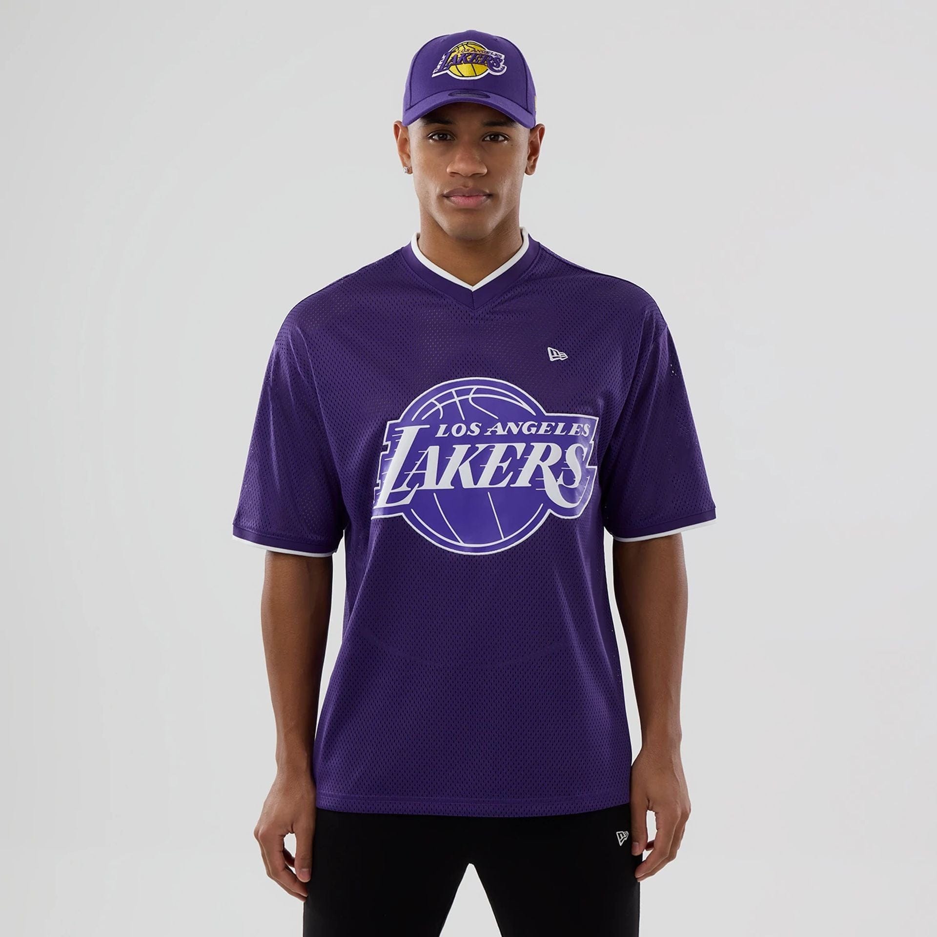 The model is wearing this NBA Mesh LA Lakers Oversized T-Shirt in purple. 1