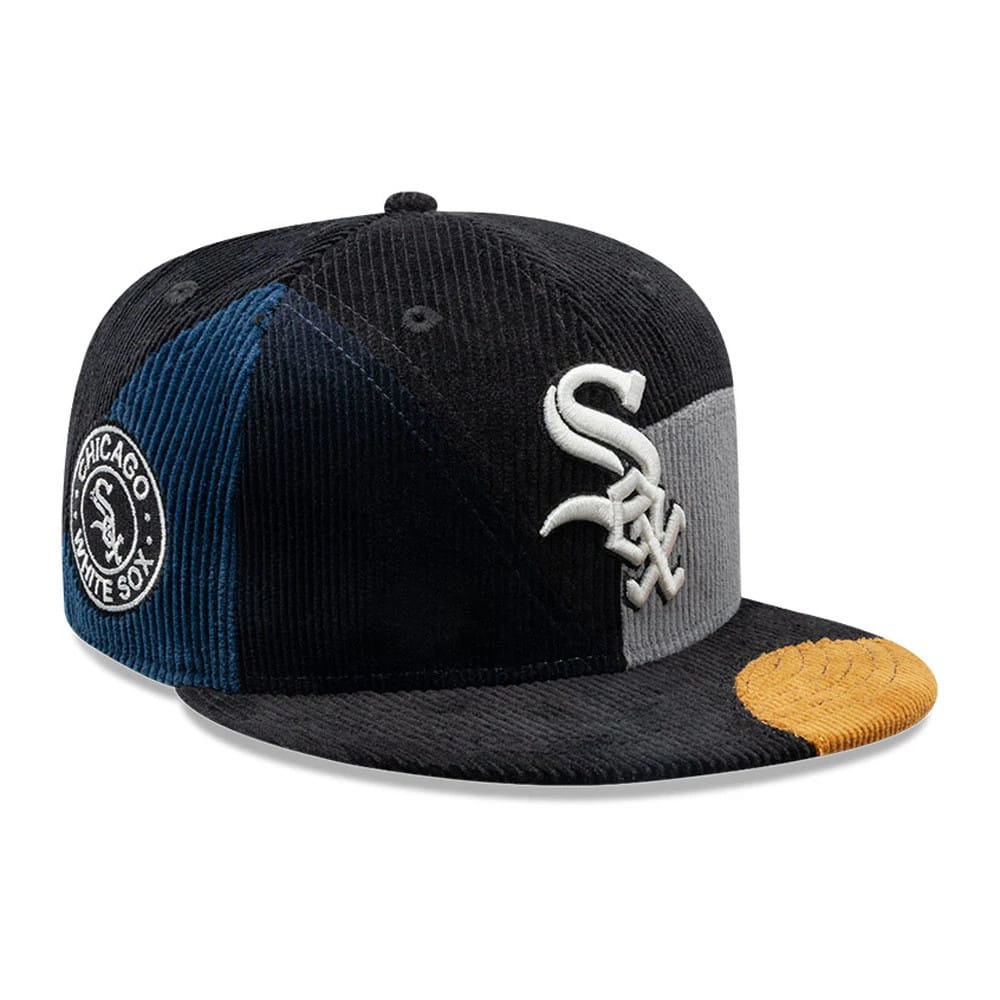 Chicago White Sox MLB Patchwork Black New Era 59FIFTY Fitted Cap, front view showing the white embroidered Sox logo on a panel of black and grey corduroy, a contrasting yellow patch on the left side of the visor, and navy eyelets.