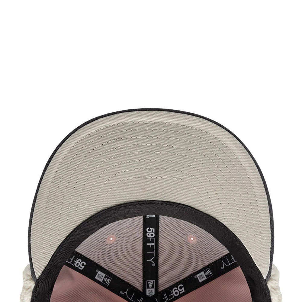 Chicago Blackhawks NHL Patch Pastel Pink New Era 59FIFTY Fitted Cap, inside view showing the black branded taping with 59FIFTY lettering, pastel pink interior panels, and a contrasting grey undervisor.