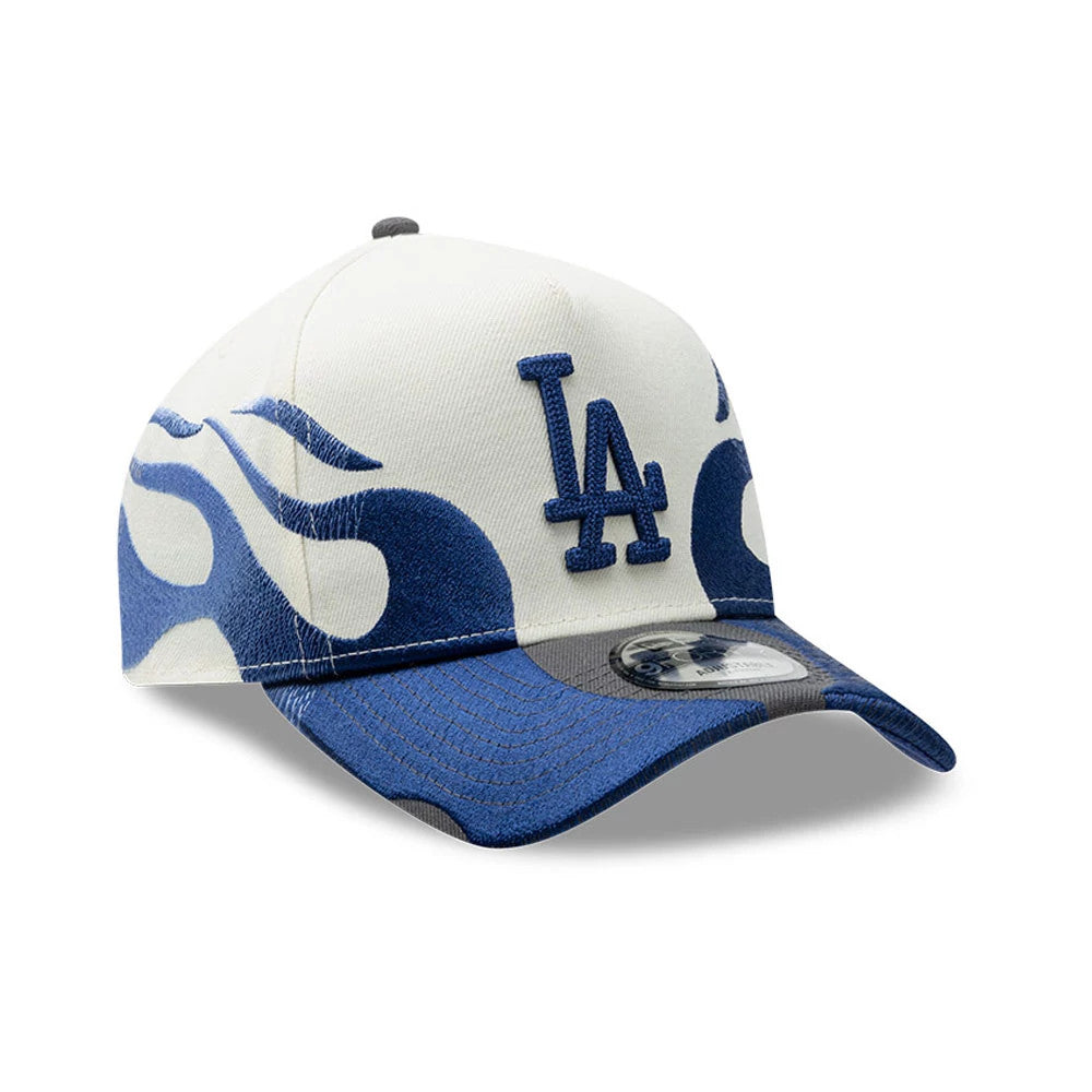 LA Dodgers MLB Flame Cream New Era 9FORTY A-Frame Cap, three-quarter view showing the blue raised embroidered LA logo on the front panel, a dynamic blue flame motif wrapping around the structured cream crown.