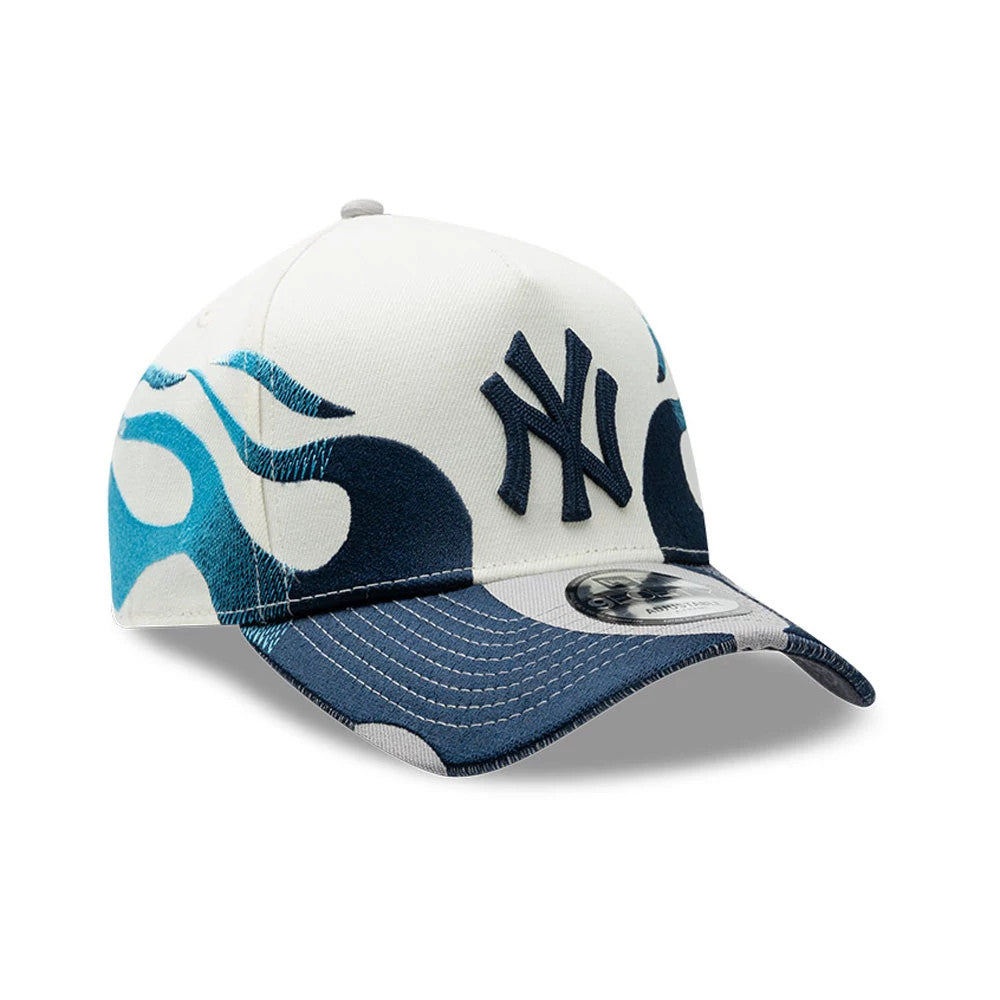 New York Yankees MLB Flame Cream New Era 9FORTY A-Frame Cap, front view with a raised navy NY logo embroidered on the centre of the cream front panel, featuring blue flame graphics on both the crown and navy curved visor with a 9FORTY size sticker.