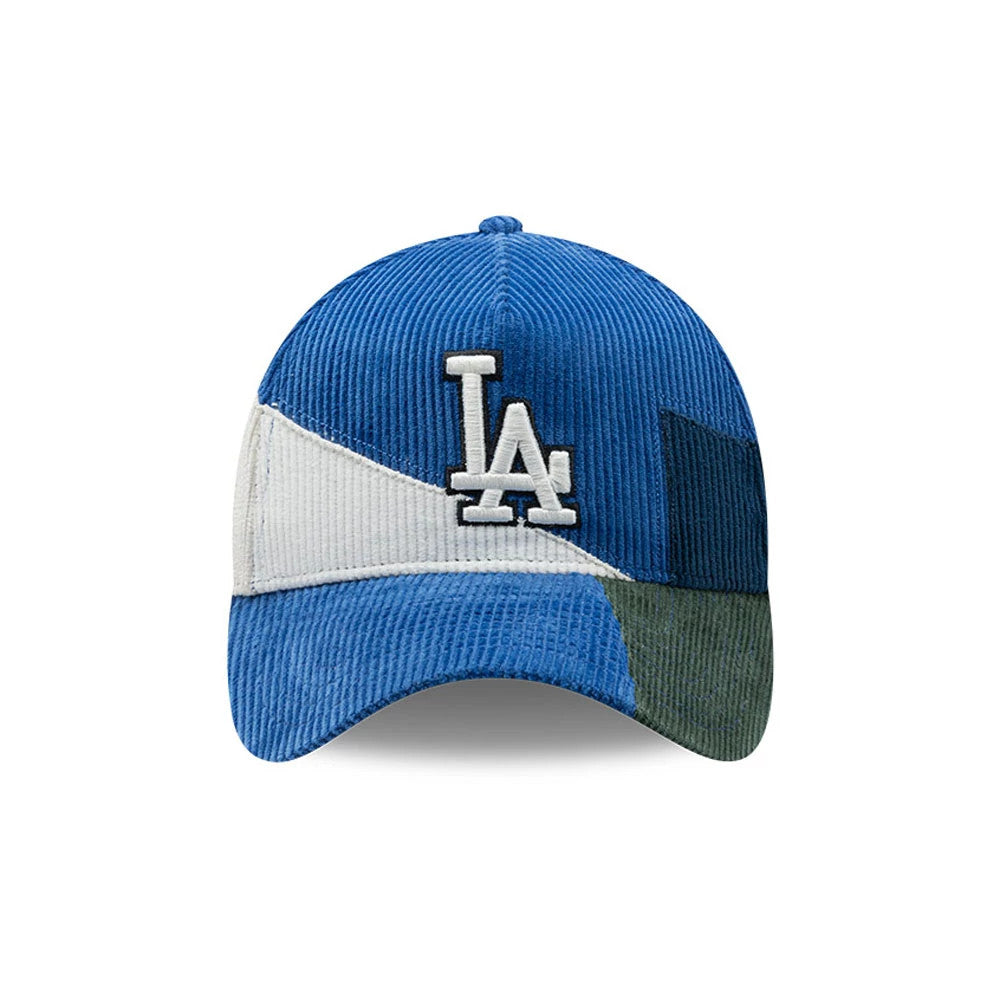 LA Dodgers MLB Patchwork Dark Blue New Era 9FORTY A-Frame Cap, front view showing the white raised embroidered LA logo on a structured blue crown, featuring a distinctive patchwork design with sections of blue, white, and dark green.
