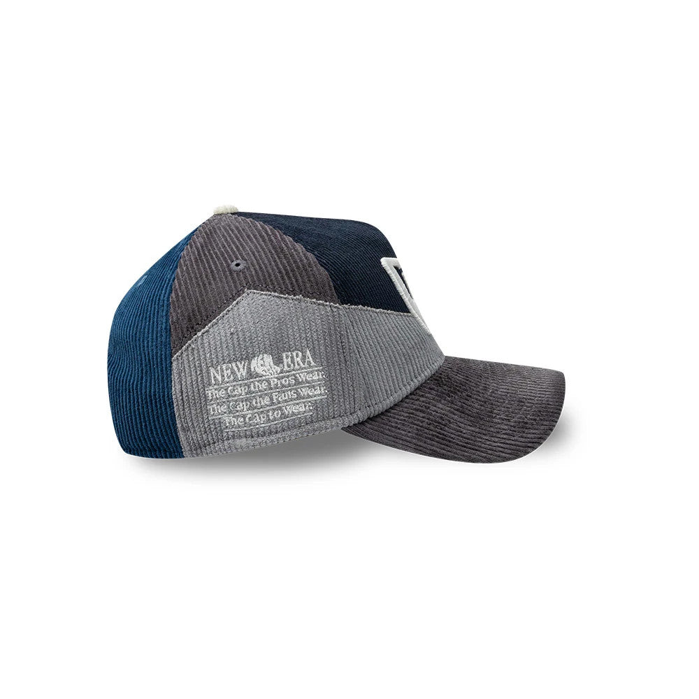 New Era Patchwork Black 9FORTY A-Frame Cap, side view showing the patchwork design with corduroy panels in blue, grey, and black, featuring an embroidered New Era logo on the grey panel and a structured black visor.