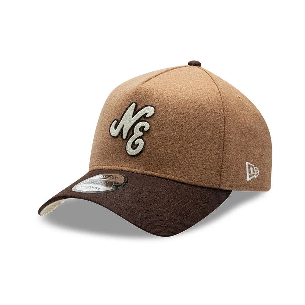 New Era Melton Wool Beige 9FORTY A-Frame Cap, three-quarter view showing a raised white NE logo embroidered on the front panel, with a contrasting dark brown visor and a small New Era flag logo on the left side.