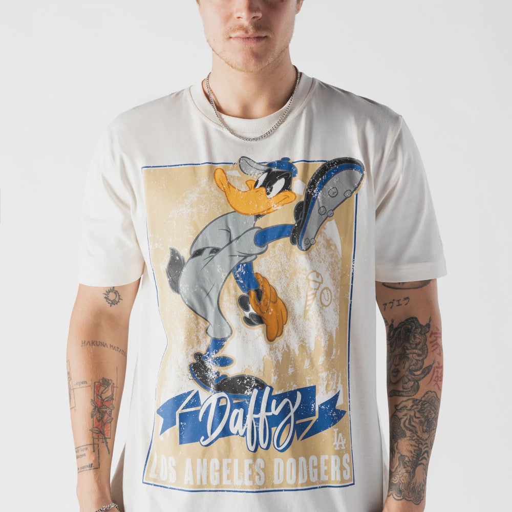 New Era LA Dodgers MLB X Looney Tunes Cream T-Shirt, front view showing a large print of Daffy Duck in a baseball uniform holding a glove, with the word Daffy in cursive below and Los Angeles Dodgers prominently displayed.