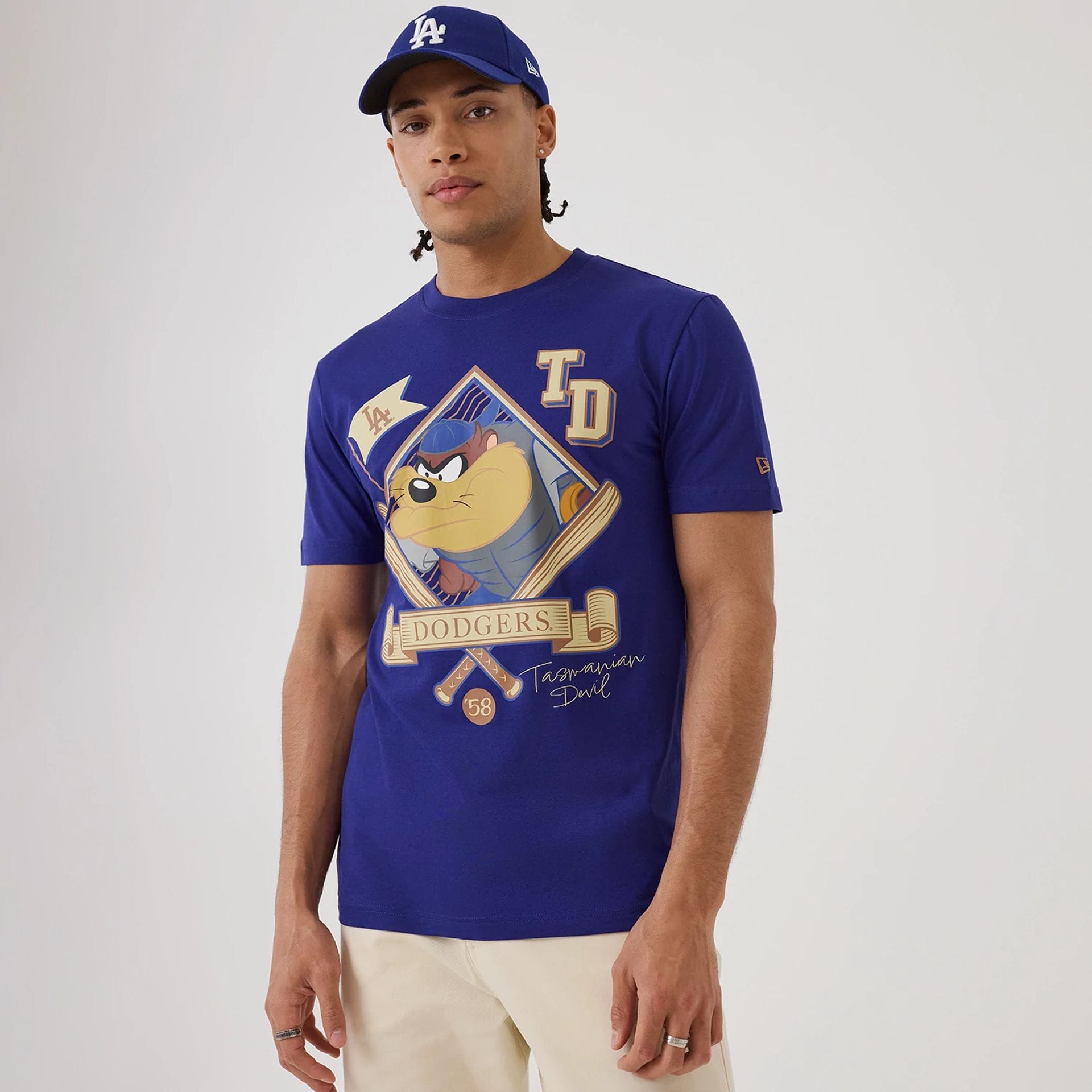 The model is wearing this MLB X Looney Tunes LA Dodgers T-Shirt in dark blue. 1