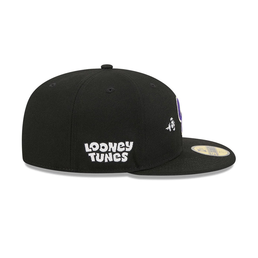 Colorado Rockies MLB X Looney Tunes Bugs Bunny Black New Era 59FIFTY Fitted Cap, side view showing the white embroidered Looney Tunes logo on the right panel, a structured black crown and a flat black visor with a gold 59FIFTY size sticker.