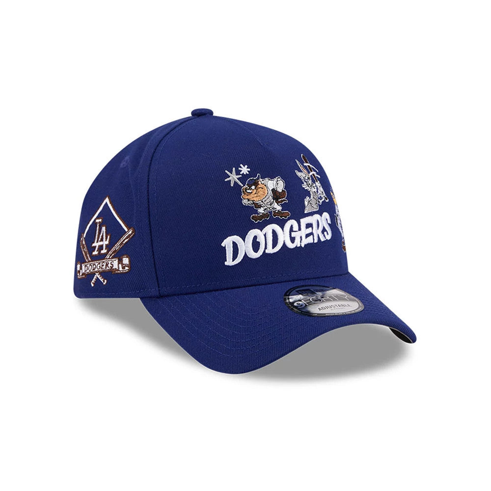 LA Dodgers MLB X Looney Tunes Dark Blue New Era 9FORTY A-Frame Adjustable Cap, three-quarter view showing Taz and Bugs Bunny embroidered on the front panel with white DODGERS lettering, dark blue curved visor, and the LA Dodgers logo on the side.